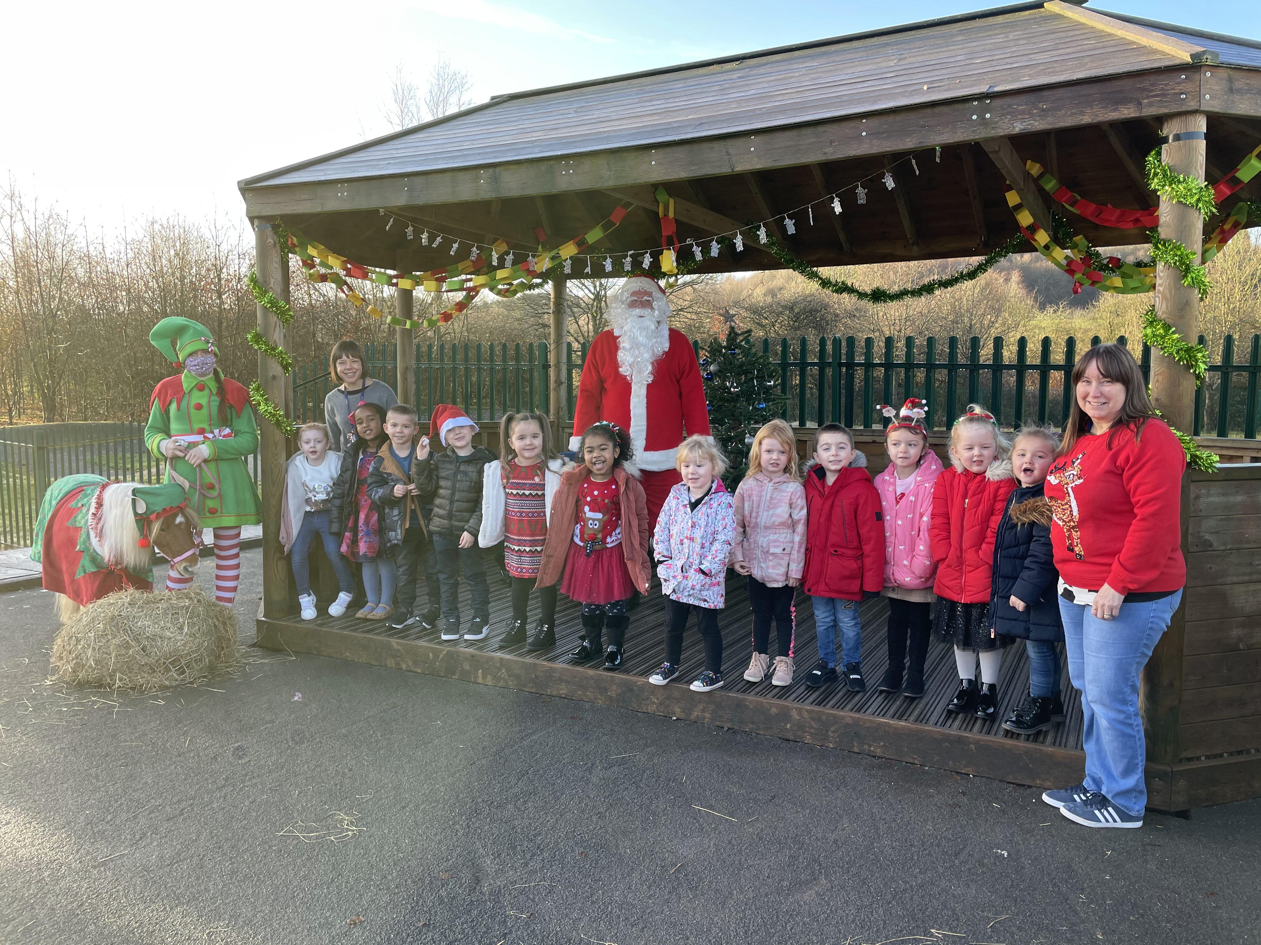 A visit from Santa and his elf and pony!