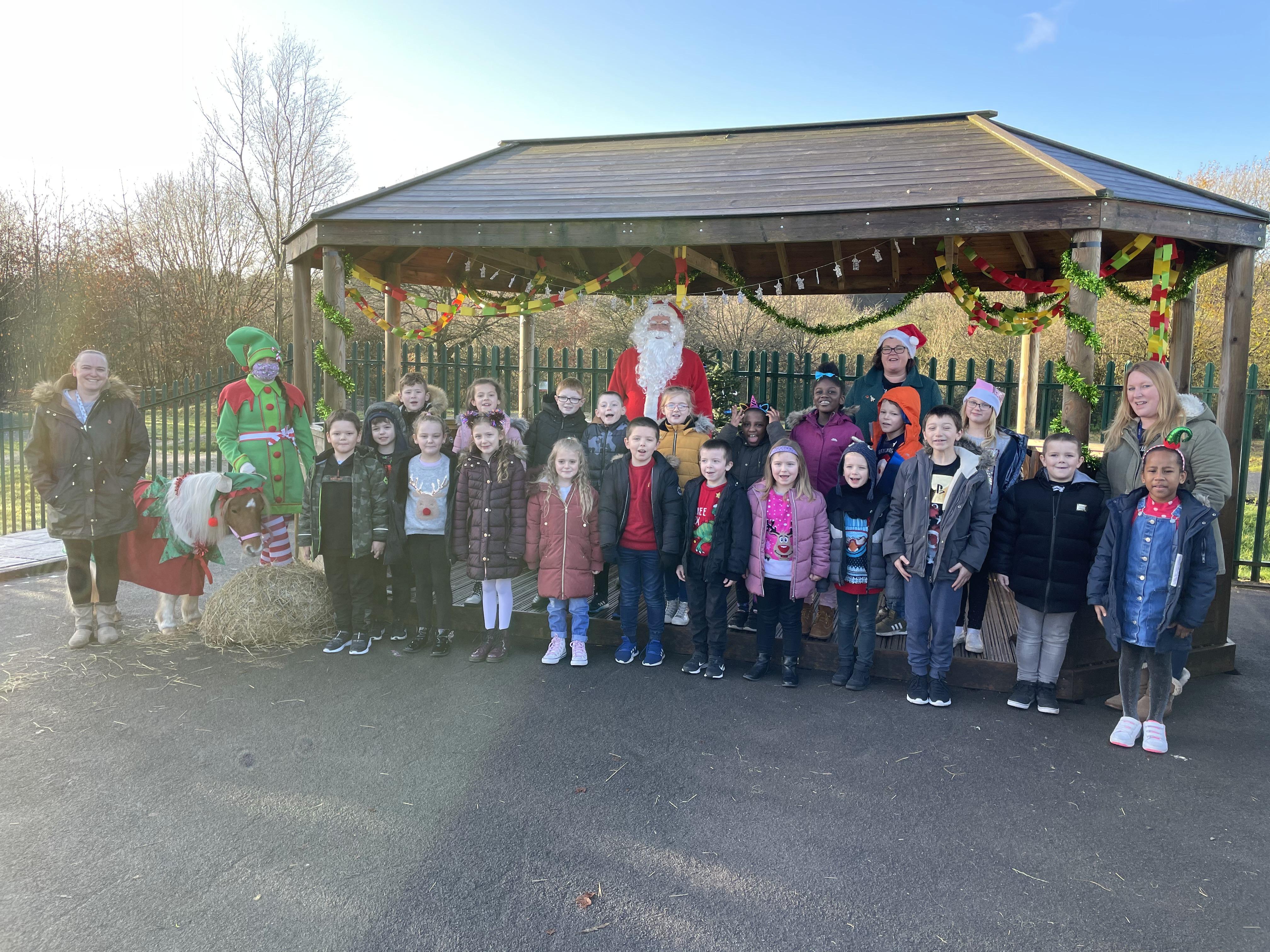A visit from Santa and his elf and pony!